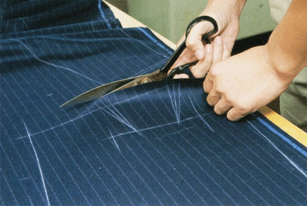 Manually cutting fabric